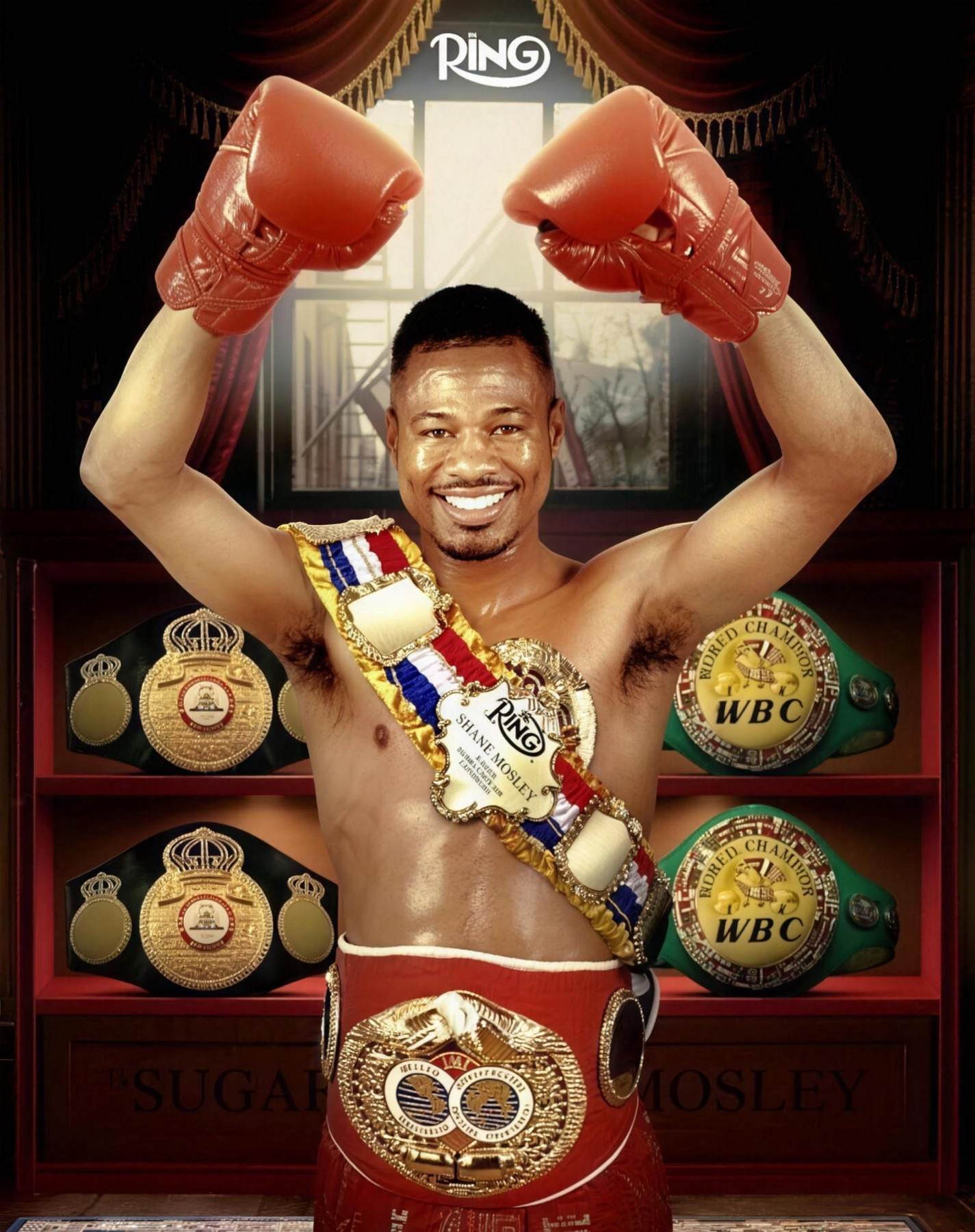Shane Mosley with gloves raised, wearing his world title belts